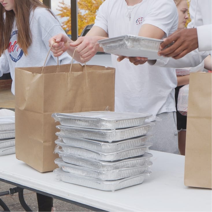 Photo of Fundraising Volunteers selling Mrs. Pumpkins meals